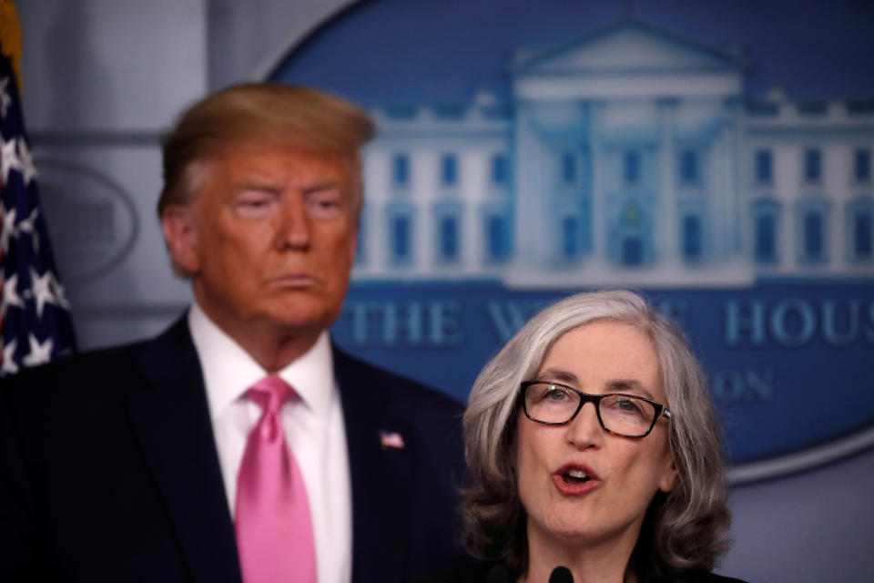 U.S. President Donald Trump listens as Dr. Anne Schuchat, Principal Deputy Director of the Centers for Disease Control and Prevention (CDC) gives a news conference at the White House in Washington, U.S., February 26, 2020.  REUTERS/Carlos Barria