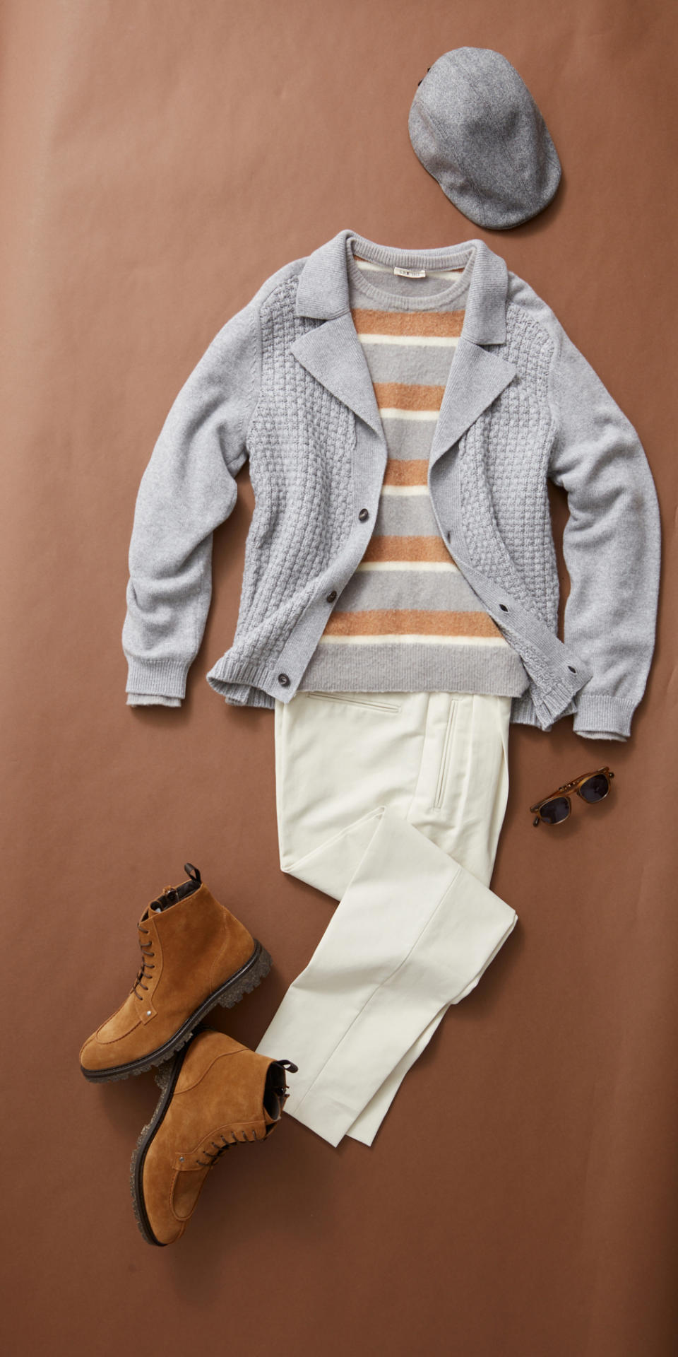 Kiton cashmere knit deconstructed jacket with embossed stitches and horn buttons, $5,360; L.B.M. 1911 wool sweater, $450; Umit Benan B+ two-pleat cotton classic pants, $1,150; Canali suede and leather boots, $795; Garrett Leight acetate sunglasses, $625.