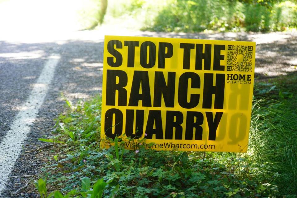 A sign opposing the proposed 70-acre open pit rock quarry is posted on the property of Andrew Clarke on September 1, 2023, in Whatcom County, Wash. Clarke’s house sits about 100 feet away from the road that would be used to truck the extracted gravel.