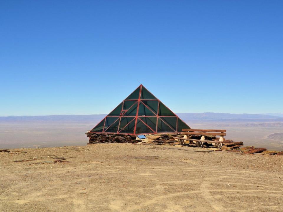 An abandoned glass pyramid weather station on the Chacaltaya mountain.