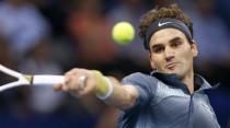 Switzerland's Roger Federer returns the ball during his quarter final match against Grigor Dimitrov of Bulgaria at the Swiss Indoors ATP tennis tournament in Basel October 25, 2013. REUTERS/Arnd Wiegmann