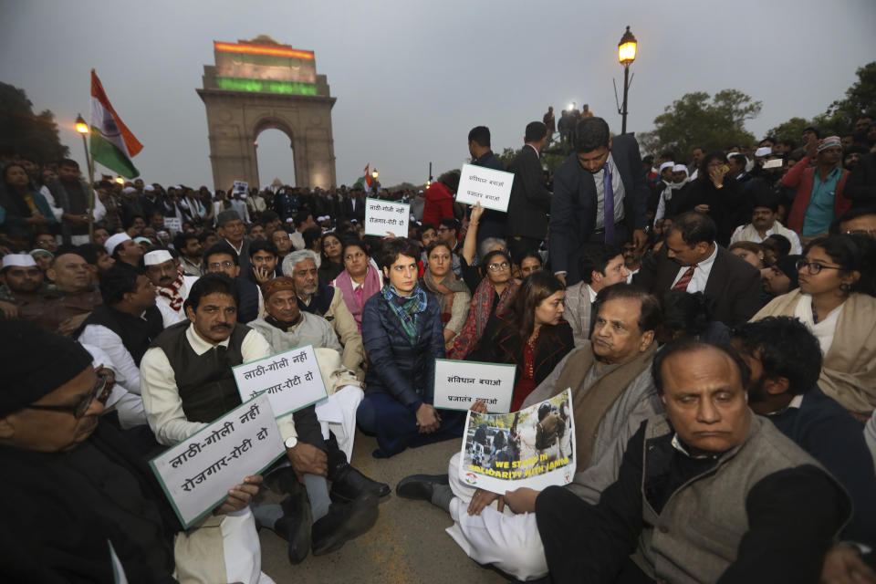 Congress party leader Priyanka Gandhi, center, joins other leaders during a sit in protest against a new citizenship law near the India Gate monument in New Delhi, India, Monday, Dec.16, 2019. The new law gives citizenship to non-Muslims who entered India illegally to flee religious persecution in several neighboring countries. (AP Photo/Manish Swarup)