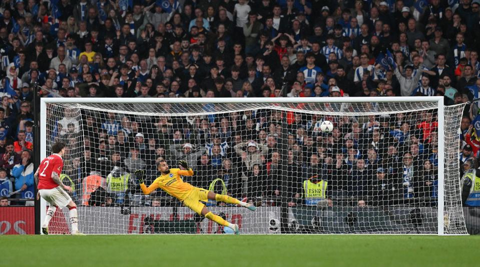   Victor Lindelof of Manchester United scores the winning penalty during the penalty shootout at the end of the FA Cup semi-final match between Brighton &  Hove Albion and Manchester United at Wembley Stadium on April 23, 2023 in London, United Kingdom. 