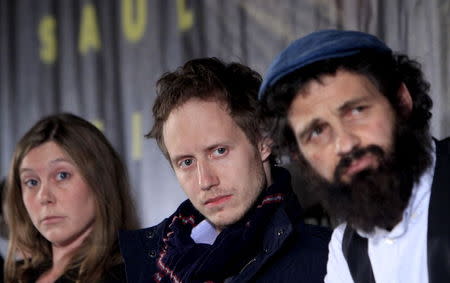 Scriptwriter Clara Royer (L-R), director Laszlo Nemes and lead actor Geza Rohrig attend a news conference for the film "Son of Saul" in Budapest, Hungary, May 28, 2015. REUTERS/Bernadett Szabo