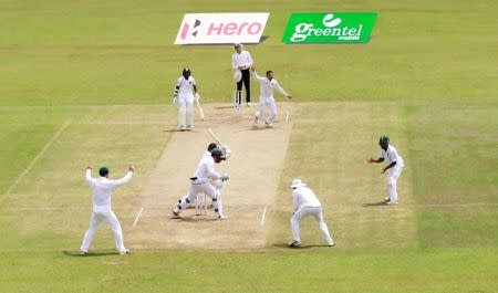 Cricket - Sri Lanka v South Africa -Second Test Match - Colombo, Sri Lanka - July 21, 2018 - Keshav Maharaj of South Africa celebrates his ninth wicket of Rangana Herath of Sri Lanka. REUTERS/Dinuka Liyanawatte