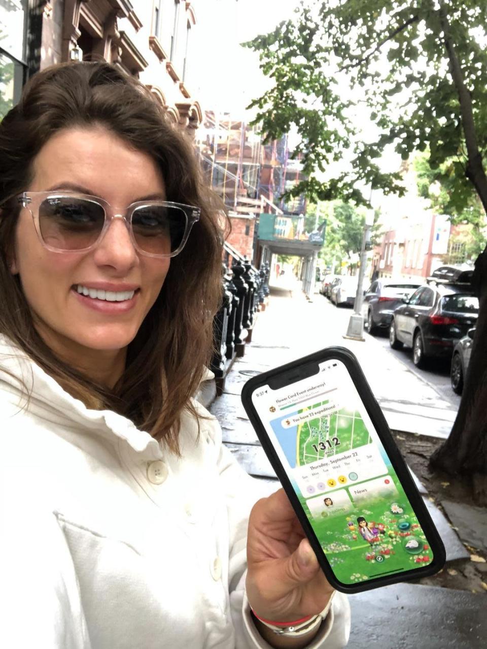 Jen Widerstrom shows Pikmin Bloom her step count while walking in Manhattan.