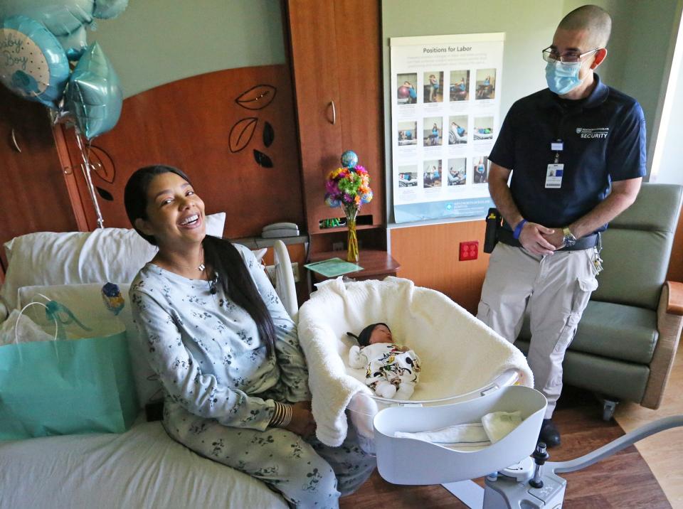 Rochela Gonzalez laughs Friday, Sept. 16, 2022 while sharing the story of delivering her son, Tiago, in a car in Wentworth-Douglass Hospital's parking lot in Dover with the help of security guard Andy Clark earlier in the week.