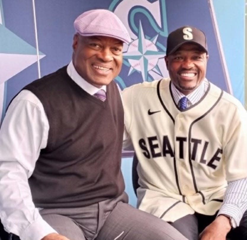 Dave Sims is known for his stylish hats as much as for his passion as the Mariners play-by-play announcer. Here, he poses with gold glove winner Harold Reynolds, who is an Emmy-winning broadcaster for MLB Network.