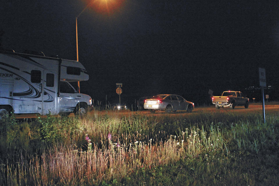CORRECTS SOURCE TO HOMER NEWS - Vehicles are stopped and prevented from entering the Homer Spit in the early morning hours of Wednesday, July 22, 2020, after a powerful earthquake shook the region late Tuesday evening in Homer, Alaska. (Megan Pacer/Homer News via AP)