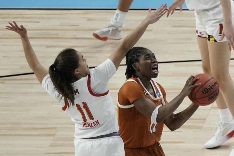 Texas's Joanne Allen-Taylor shoots past Maryland's Katie Benzan during the second half of an NCAA college basketball game in the Sweet 16 round of the Women's NCAA tournament Sunday, March 28, 2021, at the Alamodome in San Antonio. (AP Photo/Morry Gash)