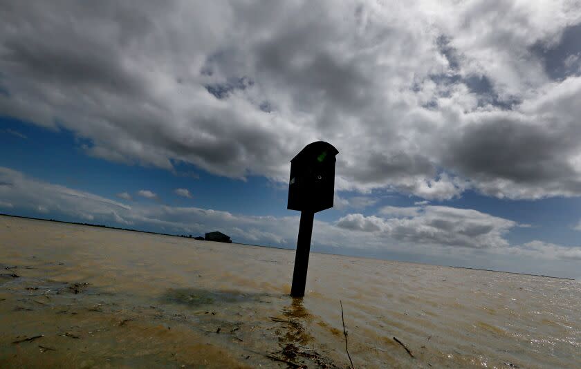 LEMOORE, CALIF. - MAR. 21, 2023. A mailbox stands in the floodwaters that have innundated farms near the community of Stratford. Recent heavy rains and snowmelt from surrounding mountains have swollen the rivers that flow into the vast and fertile San Joaquin Valley. Tulare Lake, a ghost lake that was drained more than 100 years ago, is slowly filling up and more flooding is expected with greater spring snowmelt. (Luis Sinco / Los Angeles Times)