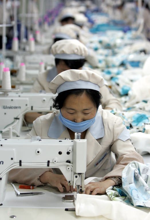 North Korean workers at the Kaesong complex on May 26, 2005. Established in 2004, the complex lies 10 kilometres (six miles) inside the North, which remains technically at war with the South after the 1950-53 Korean War was concluded with a ceasefire rather than a peace treaty