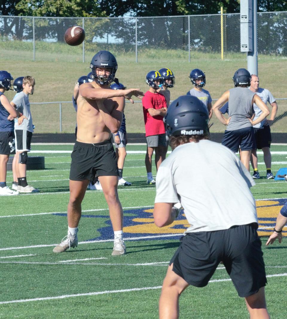 Gaylord's Brady Pretzlaff throws a pass to a receiver during a practice on Tuesday, August 8.