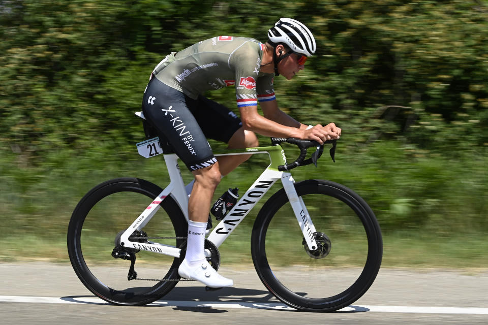 FILE - Dutch cyclist Mathieu Van der Poel competes during the 14th stage of the Giro D'Italia cycling race from Santena to Turin, Italy, Saturday, May 21, 2022. World champion Mathieu van der Poel will focus on the Olympic road race at the Paris Games this summer after the Tour de France, skipping mountain biking. The versatile Dutch racer said on Wednesday that combining the Tour and the Olympic road race is “the most logical” choice. (Fabio Ferrari/LaPresse via AP, File)