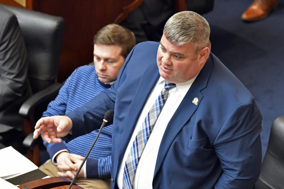 Kentucky State Rep. Chris Fugate addresses his fellow Representatives on Ky. Senate Bill 4, an act relating to warrants authorizing entry without notice during the final day of the State Legislature at the Kentucky State Capitol in Frankfort, Ky., Tuesday, March 30, 2021. (AP Photo/Timothy D. Easley)