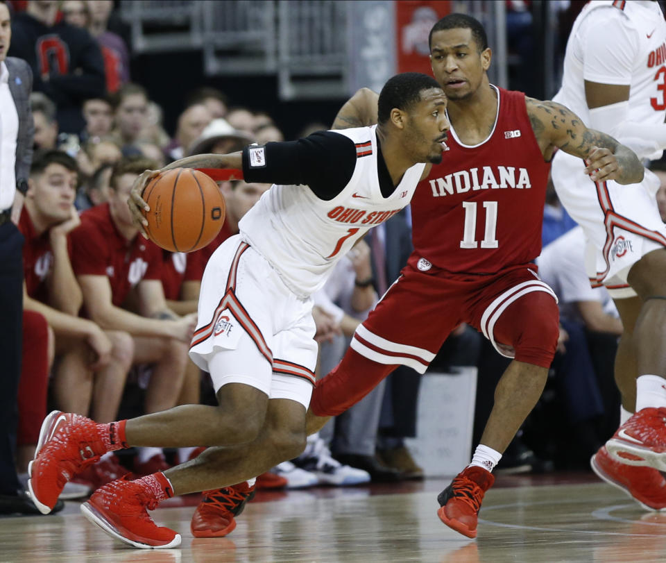 Ohio State's Luther Muhammad, left, drives to the basket as Indiana's Devonte Green defends during the first half of an NCAA college basketball game Saturday, Feb. 1, 2020, in Columbus, Ohio. (AP Photo/Jay LaPrete)