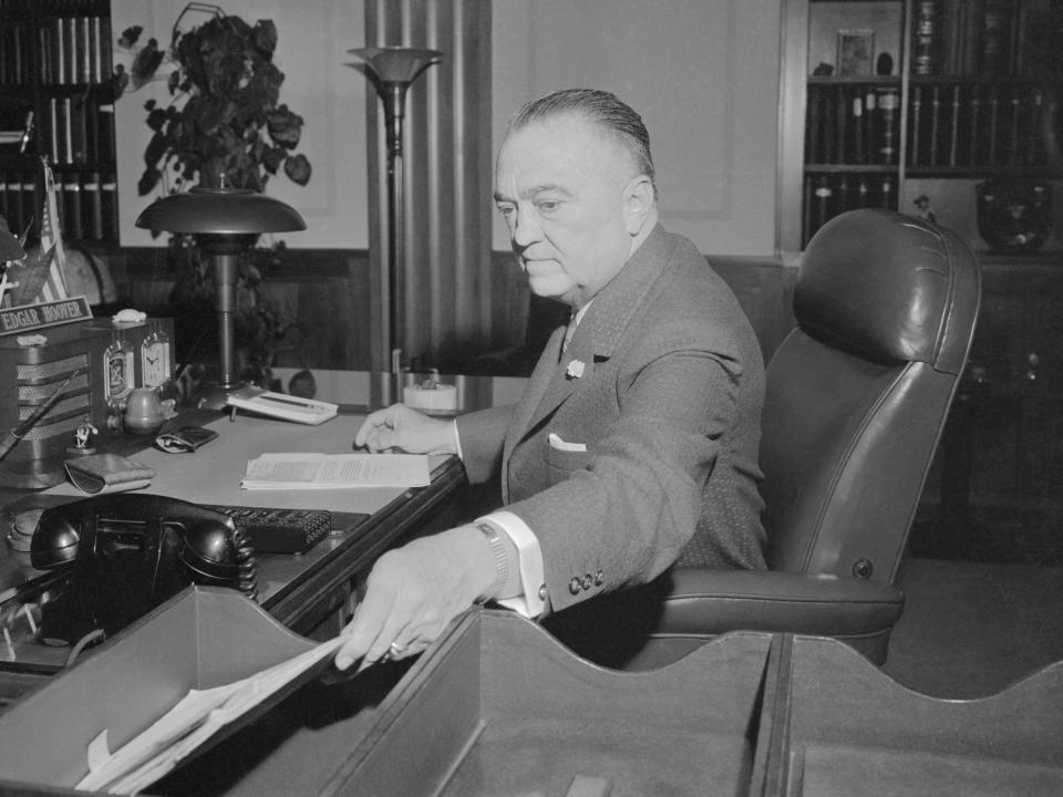 J. Edgar Hoover is shown at his desk at the Federal Bureau of Investigation.
