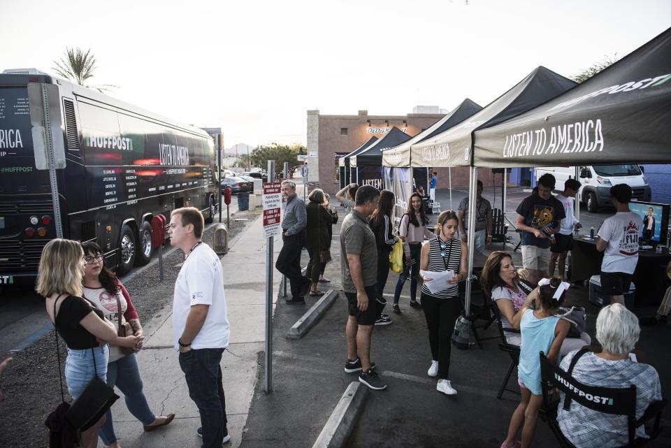 People visit the "Listen to America" tents.