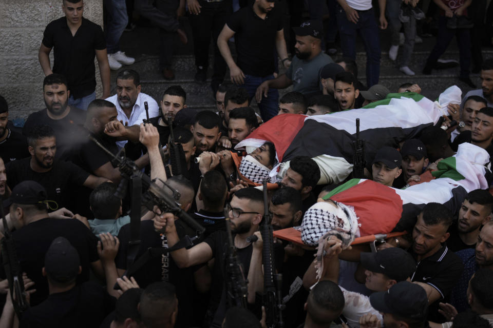 Palestinian mourners carry the bodies of Said Mesha and Adnan Araj during their funeral in the Balata refugee camp near the West Bank town of Nablus Saturday, May 13, 2023. The Israeli military raided the Balata refugee camp in the West Bank, sparking a firefight that killed Araj and Mesha. Israel said both men were armed. (AP Photo/Majdi Mohammed)