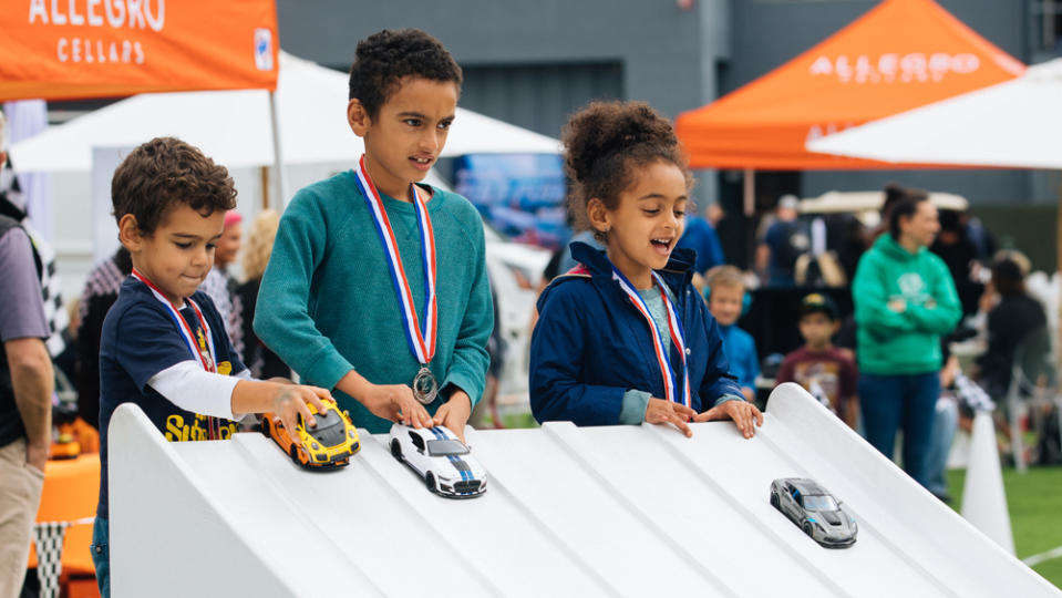 Kids play with toy cars at the 2022 Velocity Invitational.