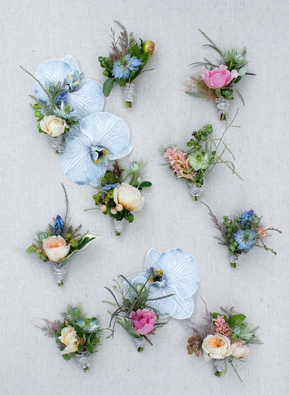 Groom and groomsmen’s boutonnieres by Kiana, inspired by “something blue.”