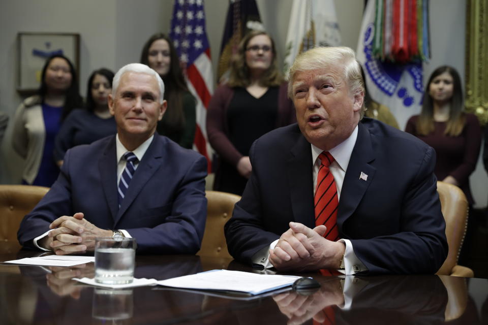 President Donald Trump arrives to speak to NASA astronauts carrying out the first ever all-female spacewalk, during a call from the Roosevelt Room of the White House, Friday, Oct. 18, 2019, in Washington, as Vice President Mike Pence looks on. (AP Photo/Evan Vucci)