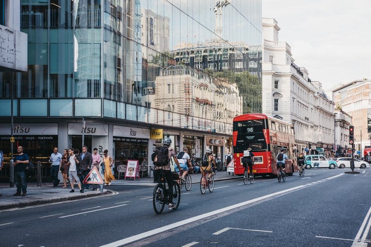 <span class="caption">Ministers are promoting public transport use, walking and cycling.</span> <span class="attribution"><a class="link " href="https://www.shutterstock.com/image-photo/london-uk-july-24-2018-cyclists-1169581654" rel="nofollow noopener" target="_blank" data-ylk="slk:Alena Veasey/Shutterstock;elm:context_link;itc:0;sec:content-canvas">Alena Veasey/Shutterstock</a></span>