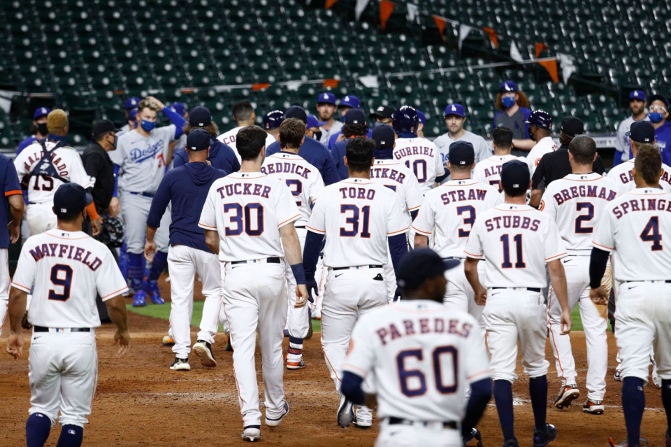 Benches empty out after Joe Kelly's exchange with Carlos Correa in the sixth inning.