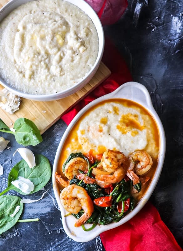 <p>Razzle Dazzle Life</p><p>Garlic butter shrimp and grits...well not your average shrimp and grits! Loaded with supple shrimp, spinach, and tomatoes. Swimming in a rich garlic butter sauce served over cheesy, creamy grits.</p><p><strong>Get the Recipe:</strong><a href="https://www.razzledazzlelife.com/shrimp-and-grits/" rel="nofollow noopener" target="_blank" data-ylk="slk:Garlic Butter Shrimp and Grits;elm:context_link;itc:0;sec:content-canvas" class="link "> <strong>Garlic Butter Shrimp and Grits</strong></a></p>