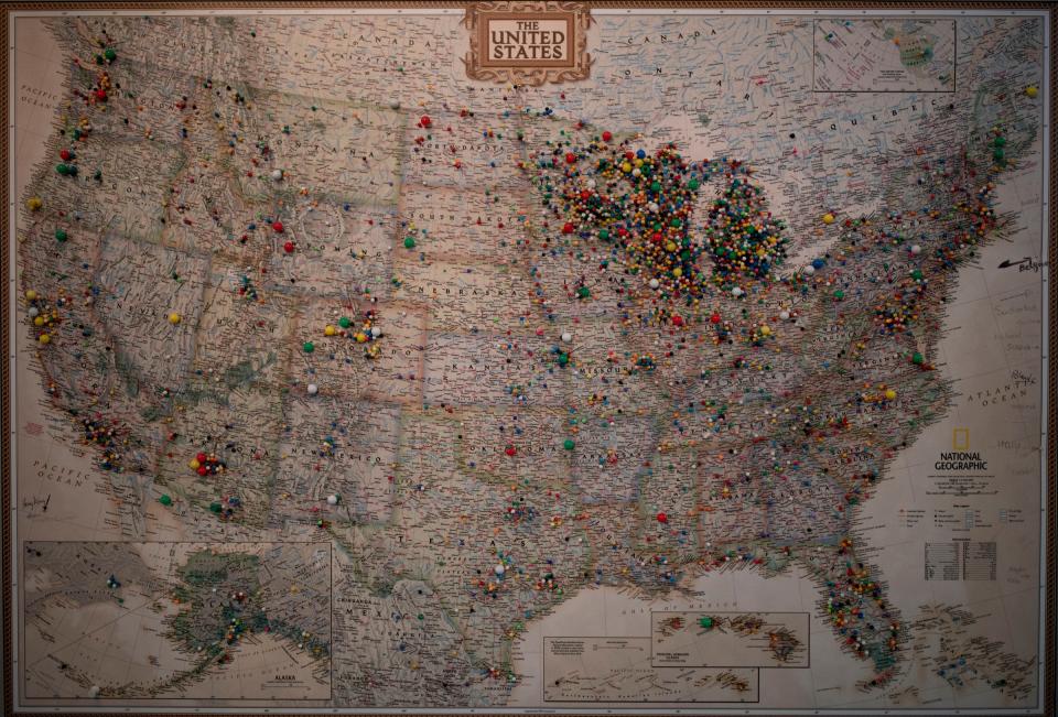 A National Geographic map with push pins hangs in the retail shop at Jacquart Fabric Products, home of Stormy Kromer, in Ironwood on Thursday, Jan. 4, 2024. The pins show what region of the country people visited from and the wide reach the Stormy Kromer brand has.