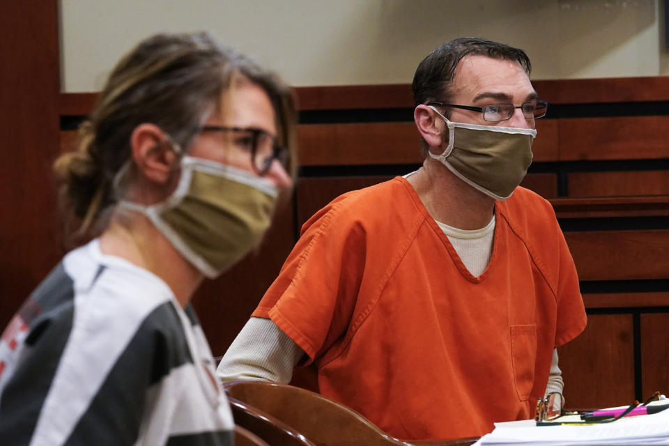 Jennifer and James Crumbley, the parents of Ethan Crumbley, a teenager accused of killing four students in a shooting at Oxford High School, appear in court for a preliminary examination on involuntary manslaughter charges in Rochester Hills, Mich., on Feb. 8, 2022. (Paul Sancya / AP file)