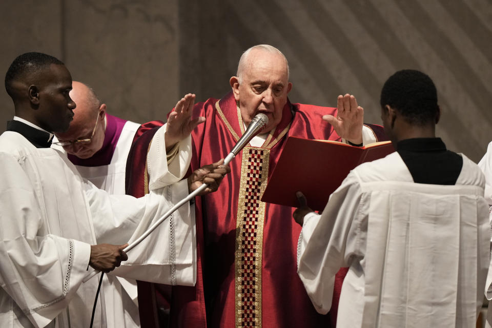 Pope Francis celebrates the Passion Mass on Good Friday, inside St. Peter's Basilica, at the Vatican, Friday, April 7, 2023. (AP Photo/Andrew Medichini)