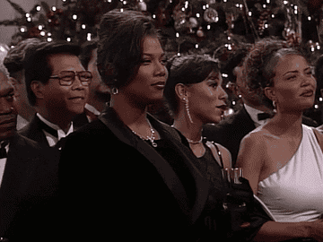 woman nodding while standing in crowd