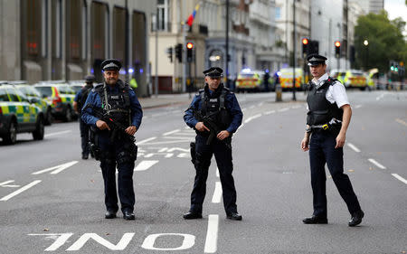 Police officers stand in the road outside the Natural History Museum, after a car mounted the pavement injuring a number of pedestrians, police said, in London, Britain October 7, 2017. REUTERS/Peter Nicholls