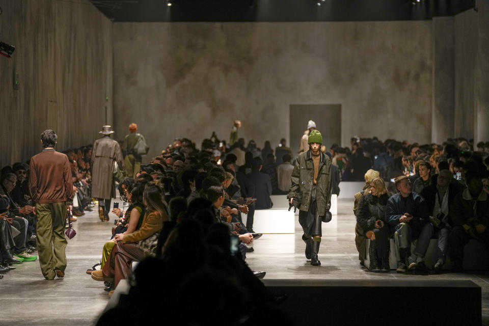 Models wear creations as part of the men's Fendi Fall-Winter 2024-2025 collection, that was presented in Milan, Italy, Saturday, Jan. 13, 2024. (AP Photo/Antonio Calanni).