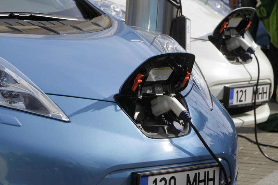 Nissan Leaf electric cars are being charged before the start of an electric car rally from Tallinn to Monte-Carlo in Tallinn June 1, 2012. The rally lasts for 10 days, during which electric cars will cross 10 countries and cover a distance of more than 3300 km (2050 miles). According to Nissan, the Leaf's expected all-electric range is 160 kilometres (100 miles). It uses a 80 kW (110 hp) front-mounted synchronous electric motor to drive the wheels, powered by a 24 kilowatt-hours lithium ion battery pack.  REUTERS/Ints Kalnins (ESTONIA - Tags: TRANSPORT ENVIRONMENT)