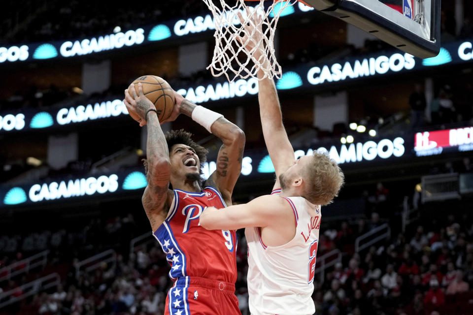 Philadelphia 76ers guard Kelly Oubre Jr., left, shoots as Houston Rockets center Jock Landale defends during the first half of an NBA basketball game Friday, Dec. 29, 2023, in Houston. (AP Photo/Eric Christian Smith)