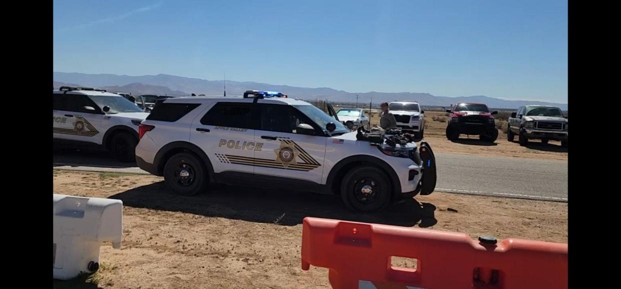 Sheriff’s deputies near the Apple Valley Airshow were seen surrounding a black vehicle and seizing illegal tactical gear. A Hesperia man was arrested.