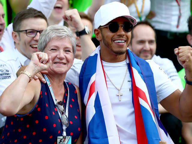 <p>Clive Rose/Getty</p> Lewis Hamilton celebrates with his mother Carmen Larbalestier after winning his fourth F1 World Drivers Championship after the Formula One Grand Prix of Mexico on October 29, 2017.