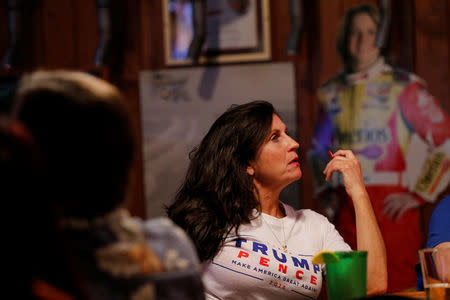 Ann Marie Wheeler watches as President Donald Trump speaks to congress during a Pinellas County Republican Party watch party in Clearwater, Florida, U.S. February 28, 2017. REUTERS/Scott Audette