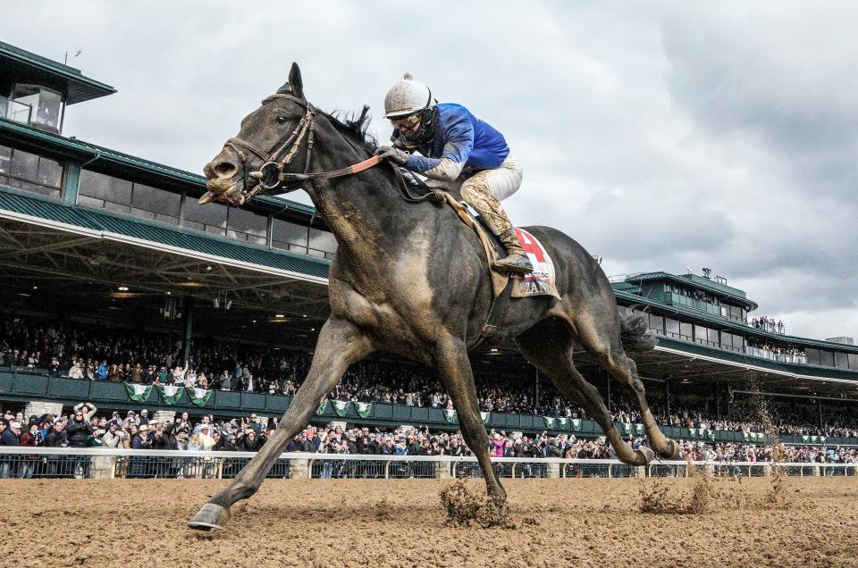 Zandon, with Flavien Prat up, wins the Blue Grass Stakes on Saturday, April 9, 2022 at Keeneland race course.