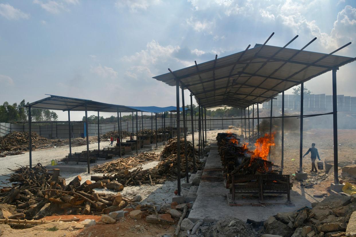 Burning pyres of the victims who died of COVID-19 are pictured at an open-air crematorium set up for the coronavirus victims inside a defunct granite quarry on the outskirts of Bangalore, India on May 8, 2021.