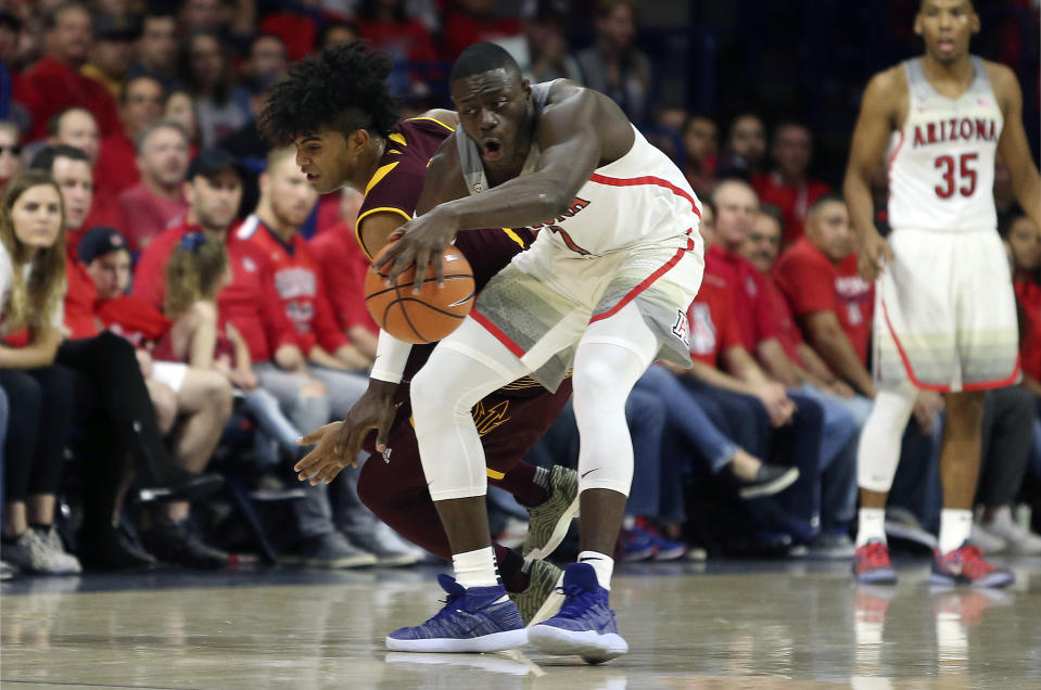 Arizona State guard Remy Martin, left, reaches to steal the ball from Arizona guard Rawle Alkins (1) during the first half of an NCAA college basketball game, Saturday, Dec. 30, 2017, in Tucson, Ariz. (AP Photo/Ralph Freso)