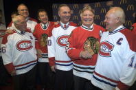 FILE - Montreal Canadiens and Chicago Blackhawks hockey legends, from left, Henri Richard, Ken Dryden, Tony Esposito, Guy Lafleur, Bobby Hull and Yvan Cournoyer pose for a photograph prior to a ceremony, Tuesday, Jan. 8, 2008, in Montreal. Hockey Hall of Famer Guy Lafleur, who helped the Montreal Canadiens win five Stanley Cup titles in the 1970s, died Friday, April 22, 2022, at age 70.(AP Photo/The Canadian Press, Paul Chiasson, File)