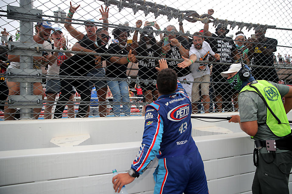 Fans cheer for Bubba Wallace, driver of the #43 Victory Junction Chevrolet, after the race at Talladega Superspeedway on June 22, 2020. (Chris Graythen/Getty Images)