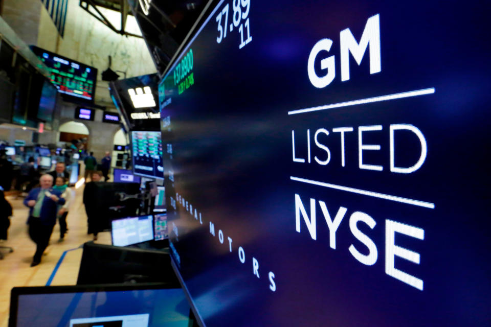 FILE - In this April 23, 2018, file photo, the logo for General Motors appears above a trading post on the floor of the New York Stock Exchange. General Motors is trying to avoid recalling potentially deadly Takata air bag inflators in thousands of full-size pickup trucks and SUVs for the fourth straight year, leaving owners to wonder if vehicles are safe to drive. (AP Photo/Richard Drew, File)