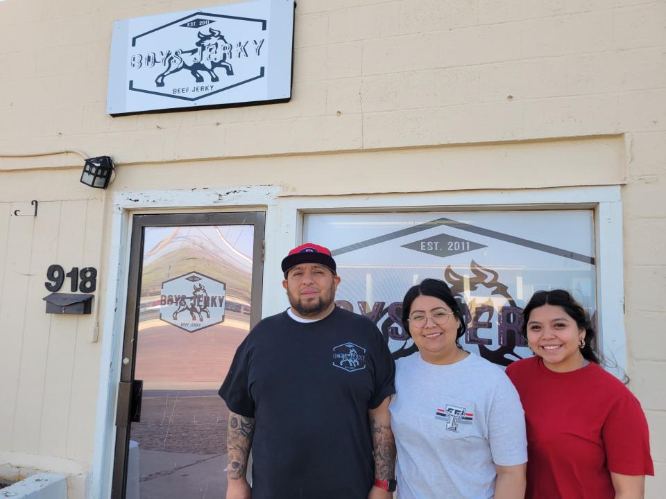 Mario Garcia, Julie Garcia, and their daughter Saydis Garcia, stand in front of Boys Jerky, 918 Broadway in Plainview, as seen on Friday, March 31, 2023.