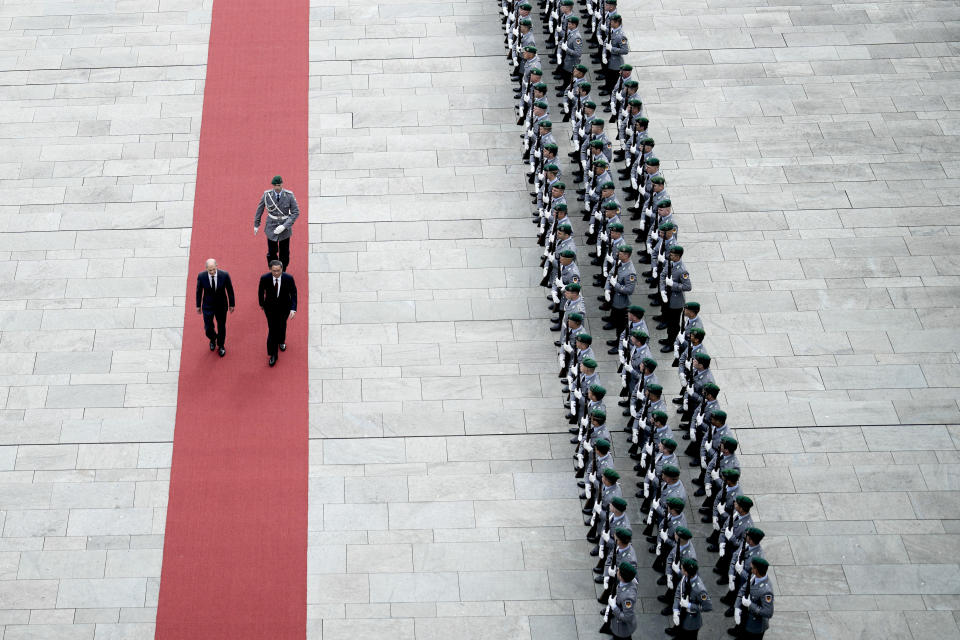 German Chancellor Olaf Scholz, center left, and Chinese Premier Li Qiang, review the honor guard during a welcome ceremony ahead of government consultations of the both countries, at the chancellery in Berlin, Germany, Tuesday, June 20, 2023. (AP Photo/Markus Schreiber)