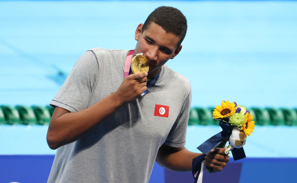 Gold medalist Ahmed Hafnaoui of Tunisia during the medals ceremony of the 400-m freestyle final on day two of the Tokyo 2020 Olympic Games at Tokyo Aquatics Centre on July 25, 2021 in Tokyo, Japan.<span class="copyright">Jean Catuffe—Getty Images</span>