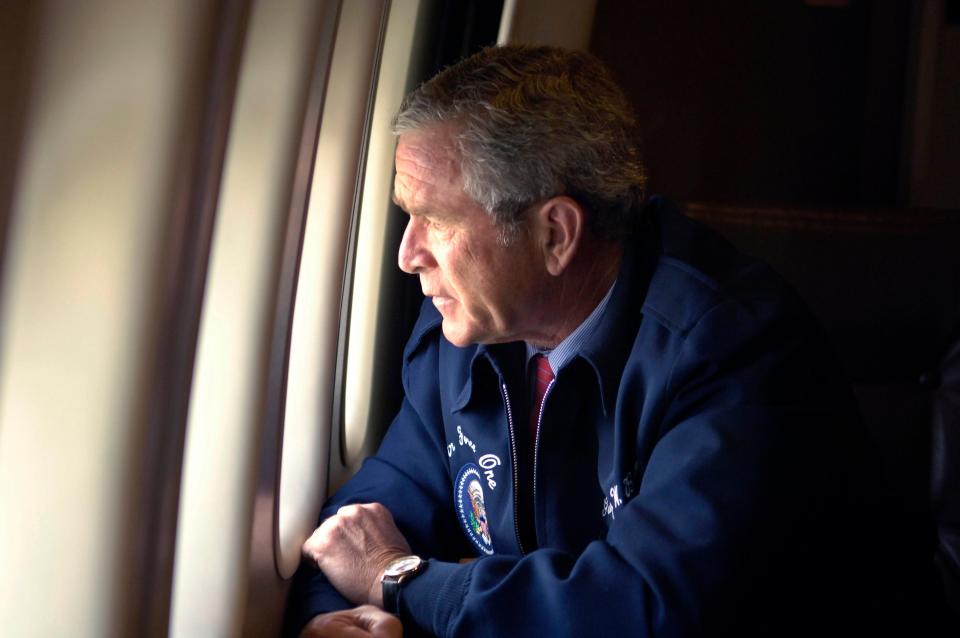 George Bush peers out the window of Air Force One as he surveys Hurricane Katrina damage along the Gulf Coast states of Louisiana, Mississippi and AlabamaREUTERS